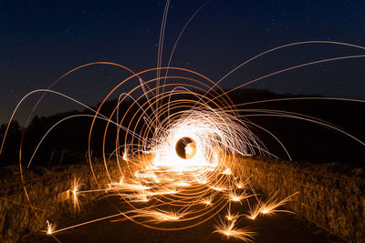 Fireworks against sky at night