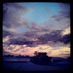 Scenic view of cloudy sky at sunset