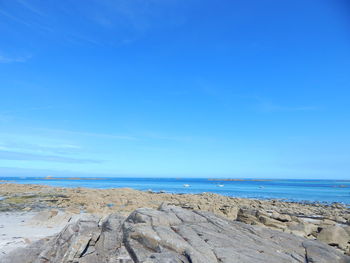 Scenic view of seascape against blue sky