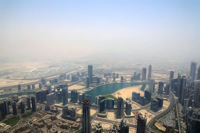 High angle view of modern buildings against clear sky