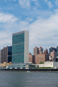 Modern buildings against sky in city