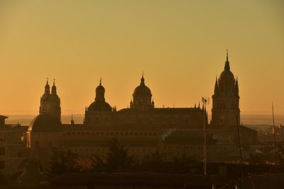 Historic building against sky during sunset