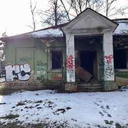 Graffiti on building covered with snow