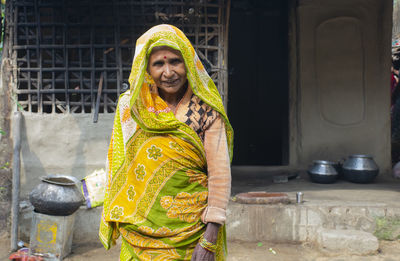 Portrait of a smiling woman wearing sari in rural india 