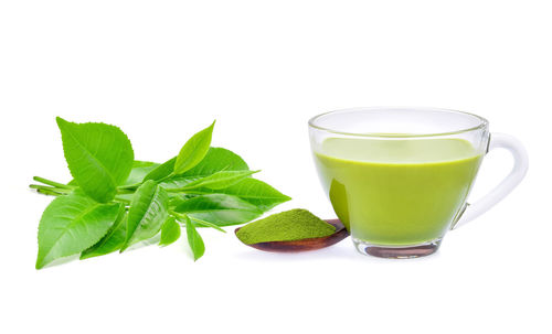 Close-up of drink against white background