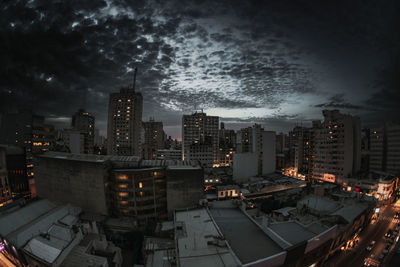 Aerial view of illuminated buildings in city at night