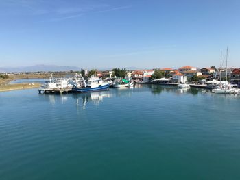 Boats moored at harbor