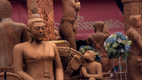 Close-up of various statues outdoors