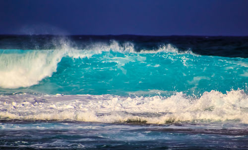 Waves splashing on rocks