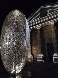 Close-up of illuminated built structure at night