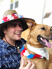 Portrait of smiling man with dog