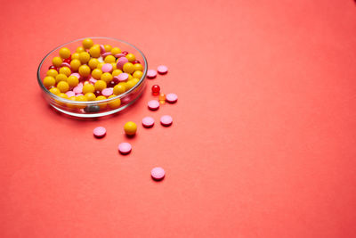 High angle view of multi colored candies on table