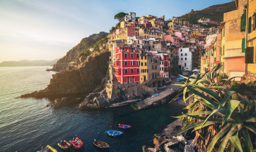 Panoramic view of sea and buildings against sky