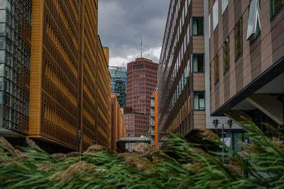 Modern buildings in city against sky
