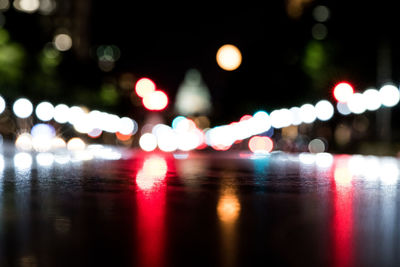 Defocused image of illuminated lights at night