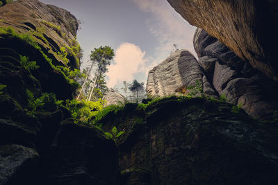 Low angle view of rocks against sky