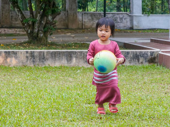 Boy on grass in park