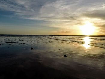 Scenic view of beach during sunset