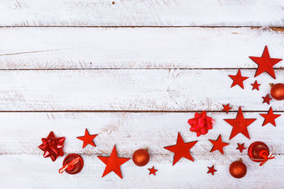 Close-up of christmas decorations hanging on white background