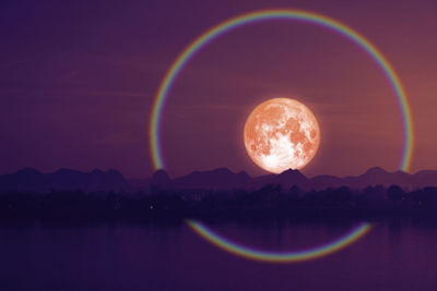 Scenic view of rainbow against sky at night