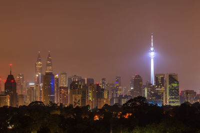 Illuminated buildings in city at night