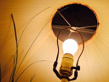 Low angle view of illuminated lamp