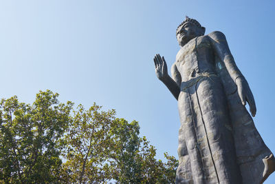 Low angle view of statue against clear sky