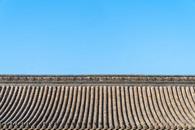 Low angle view of building against blue sky