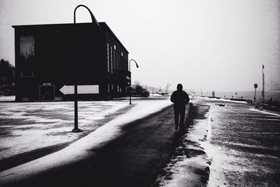 Woman walking on road