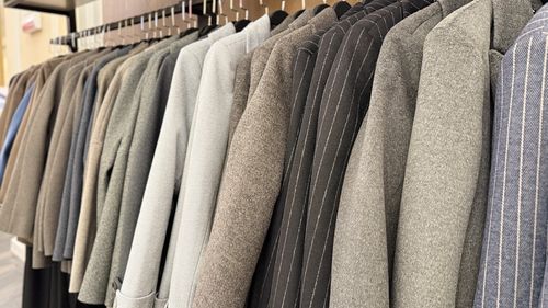 Close-up of clothes hanging on rack