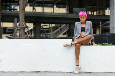 Portrait of woman sitting outdoors