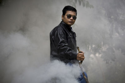 Portrait of young man posing outdoors