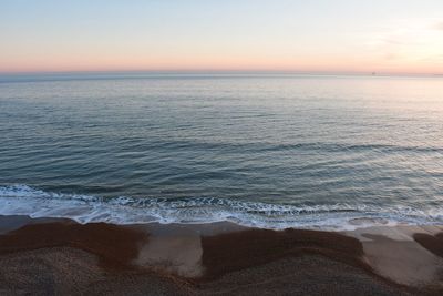 Scenic view of sea against sky during sunset in dorset