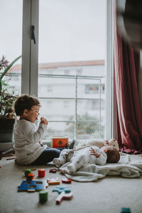 Boy playing with toy at home