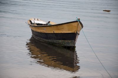 Boat moored in water