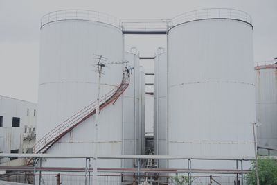 Low angle view of factory against sky