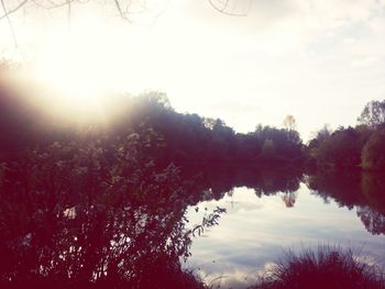 Scenic view of lake at sunset