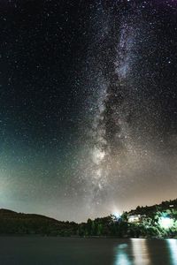 Scenic view of star field against sky at night