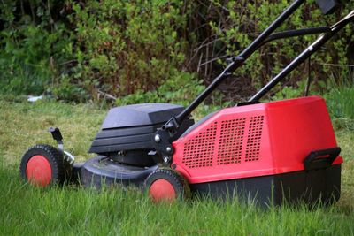 Lawn mower in grass