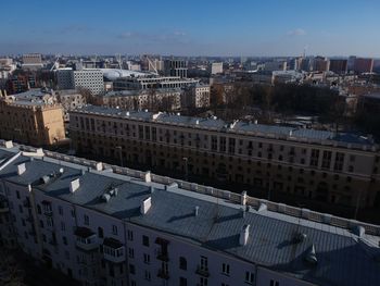 High angle view of buildings in town against sky