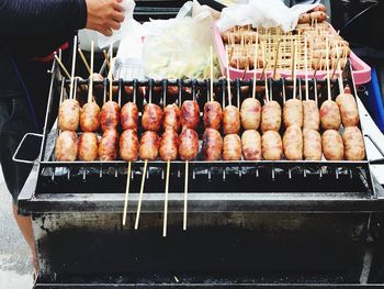 Man preparing food on barbecue grill