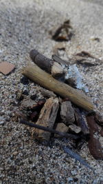 High angle view of cigarette on sand