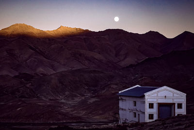 Scenic view of mountains against sky at dusk