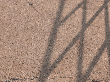 High angle view of shadow on sand