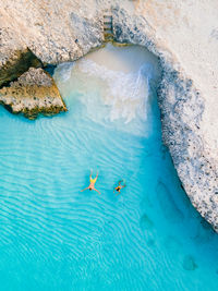 High angle view of man swimming in sea