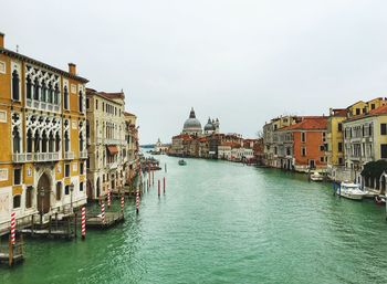 Grand canal amidst buildings against clear sky