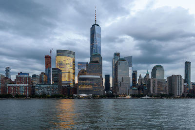 One world trade center by river in city