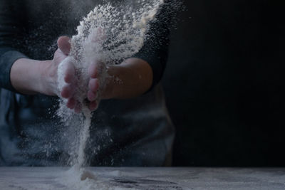 Woman baker with flour in her hands