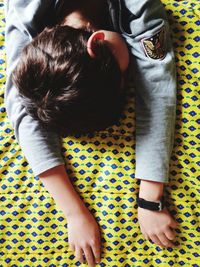 High angle view of girl relaxing on bed at home