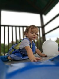 Boy playing with ball at home